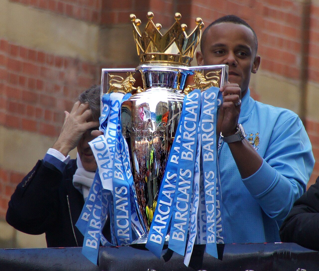 Vincent Kompany holds the Premier League trophy in 2012
